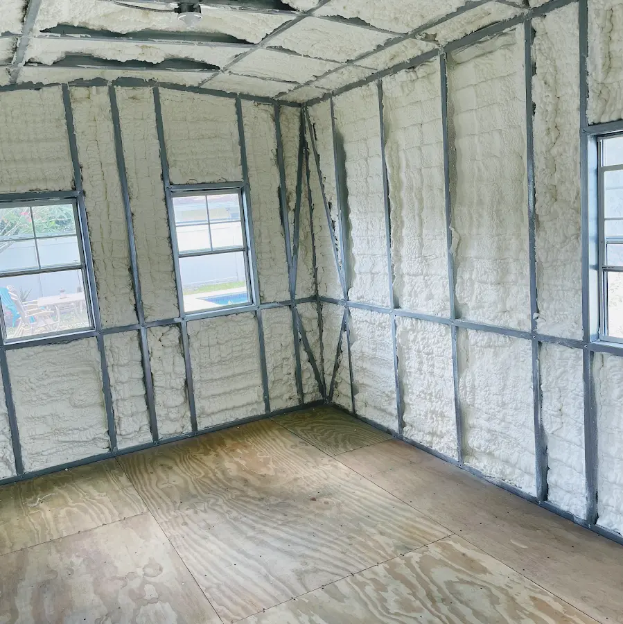 Closed-cell spray foam insulation applied to wall cavities in a residential project in Brookline